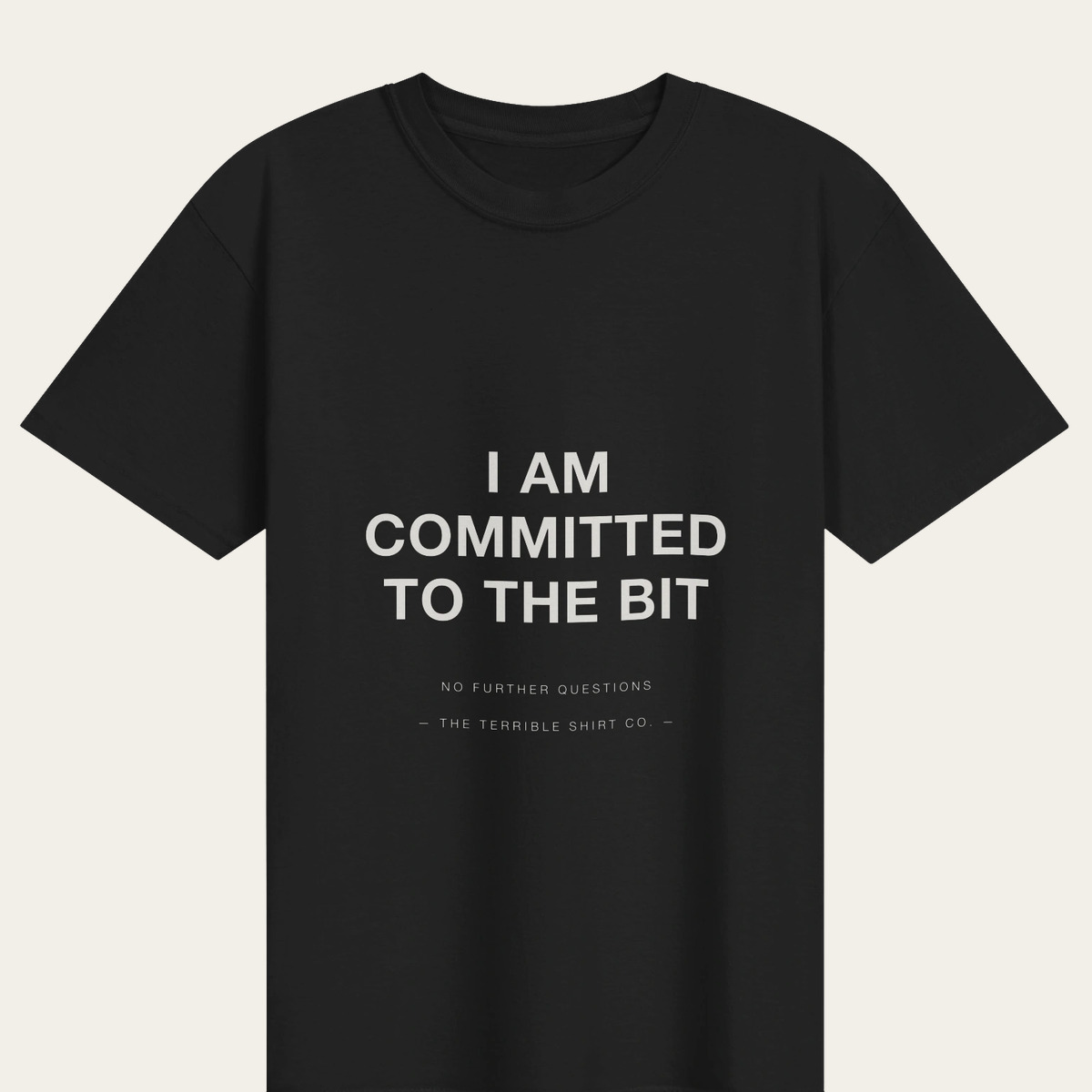 A black heavyweight tee reading I AM COMMITTED TO THE BIT.
