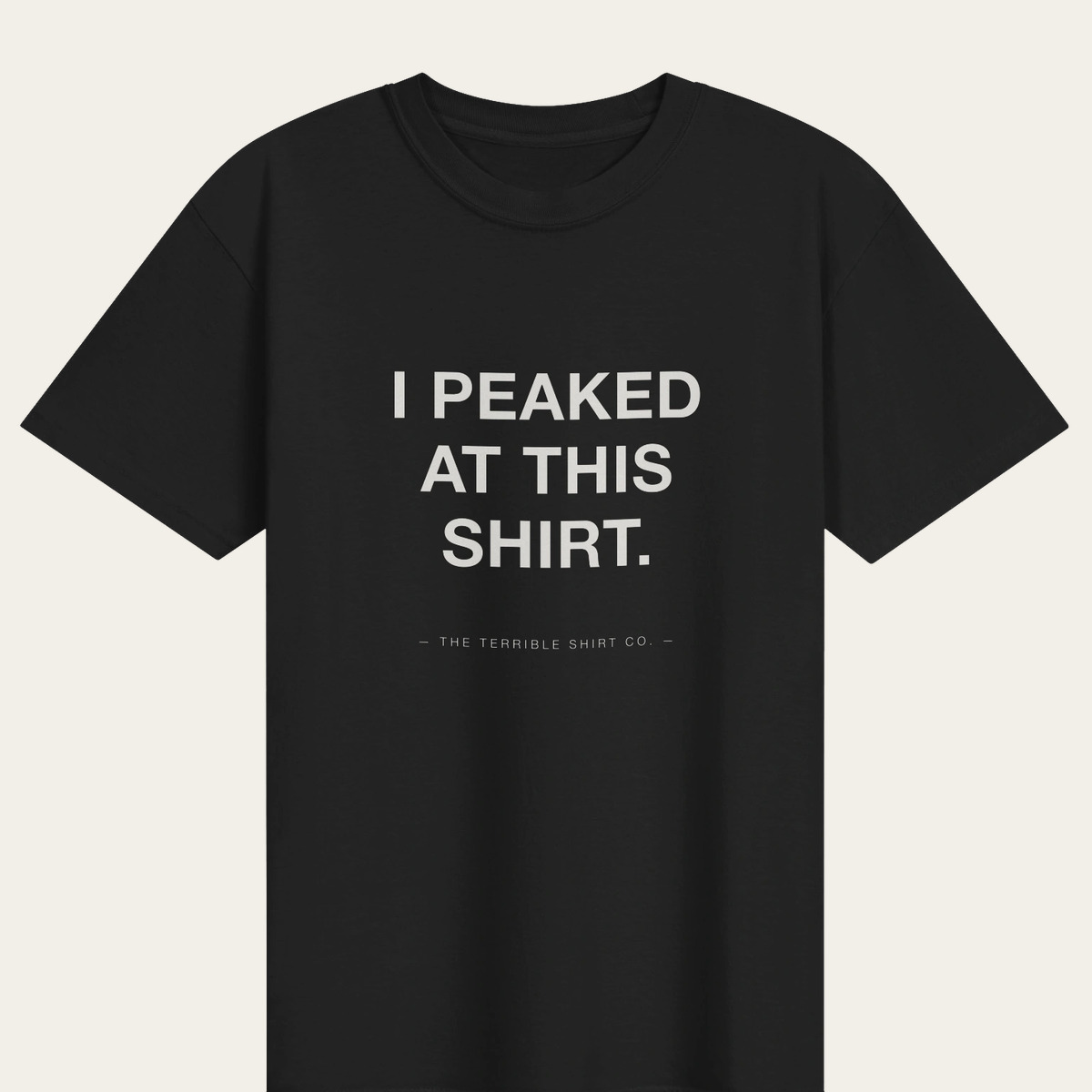 A black heavyweight tee reading I PEAKED AT THIS SHIRT.